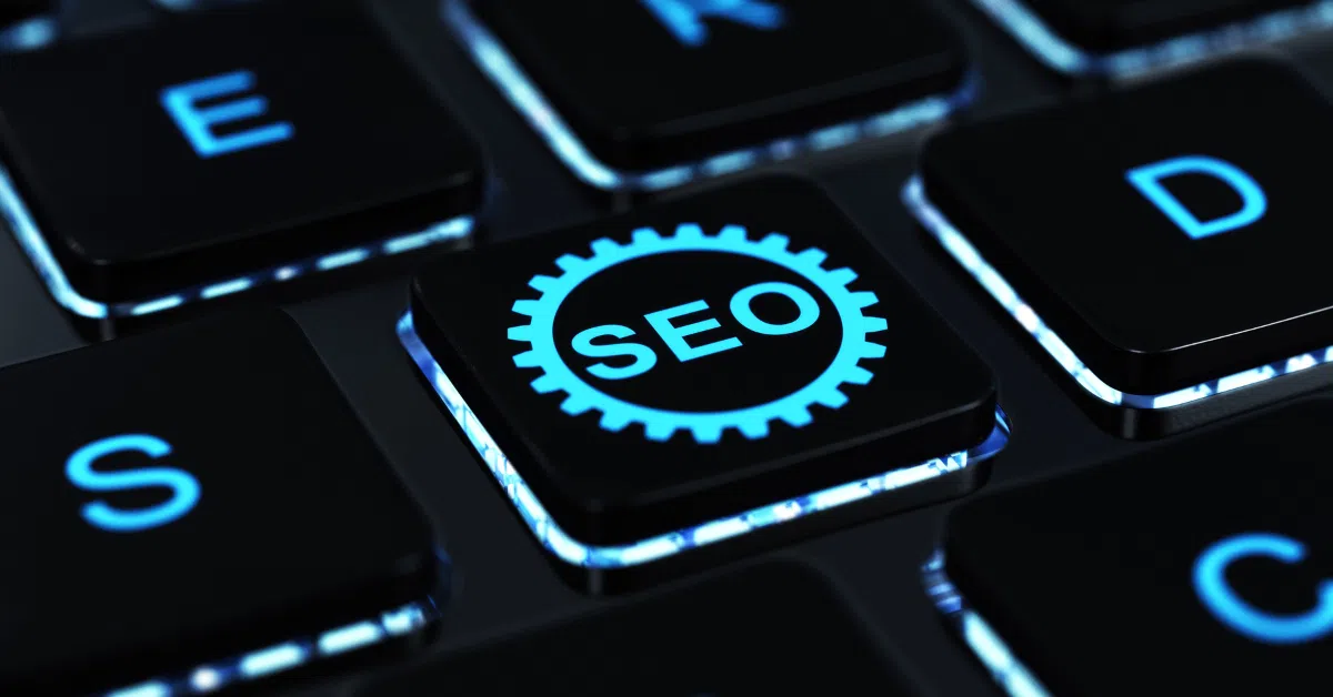 Close-up of a glowing keyboard key labeled SEO in a gear icon.